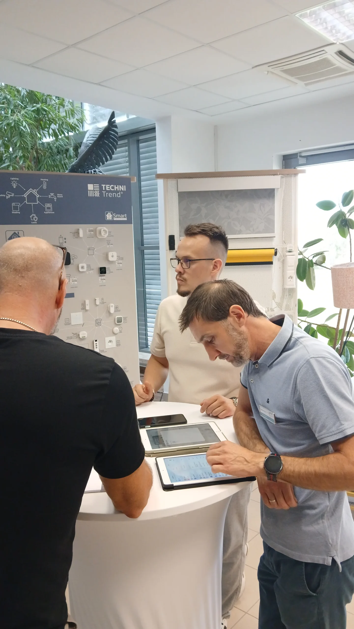 Participants discussing connected products at an exhibitor stand